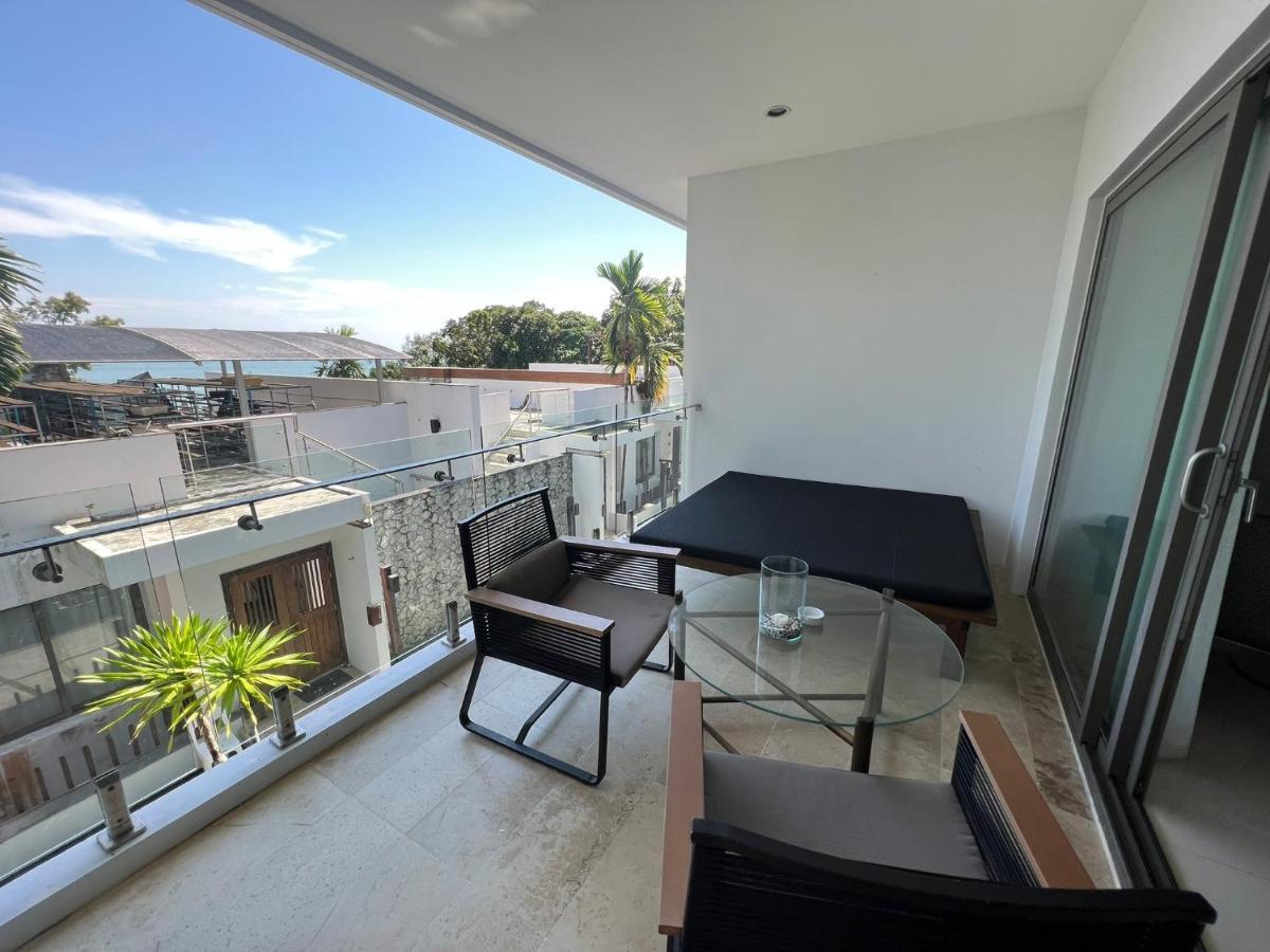 The Nchantra Beachfront Resort Phuket Exterior foto