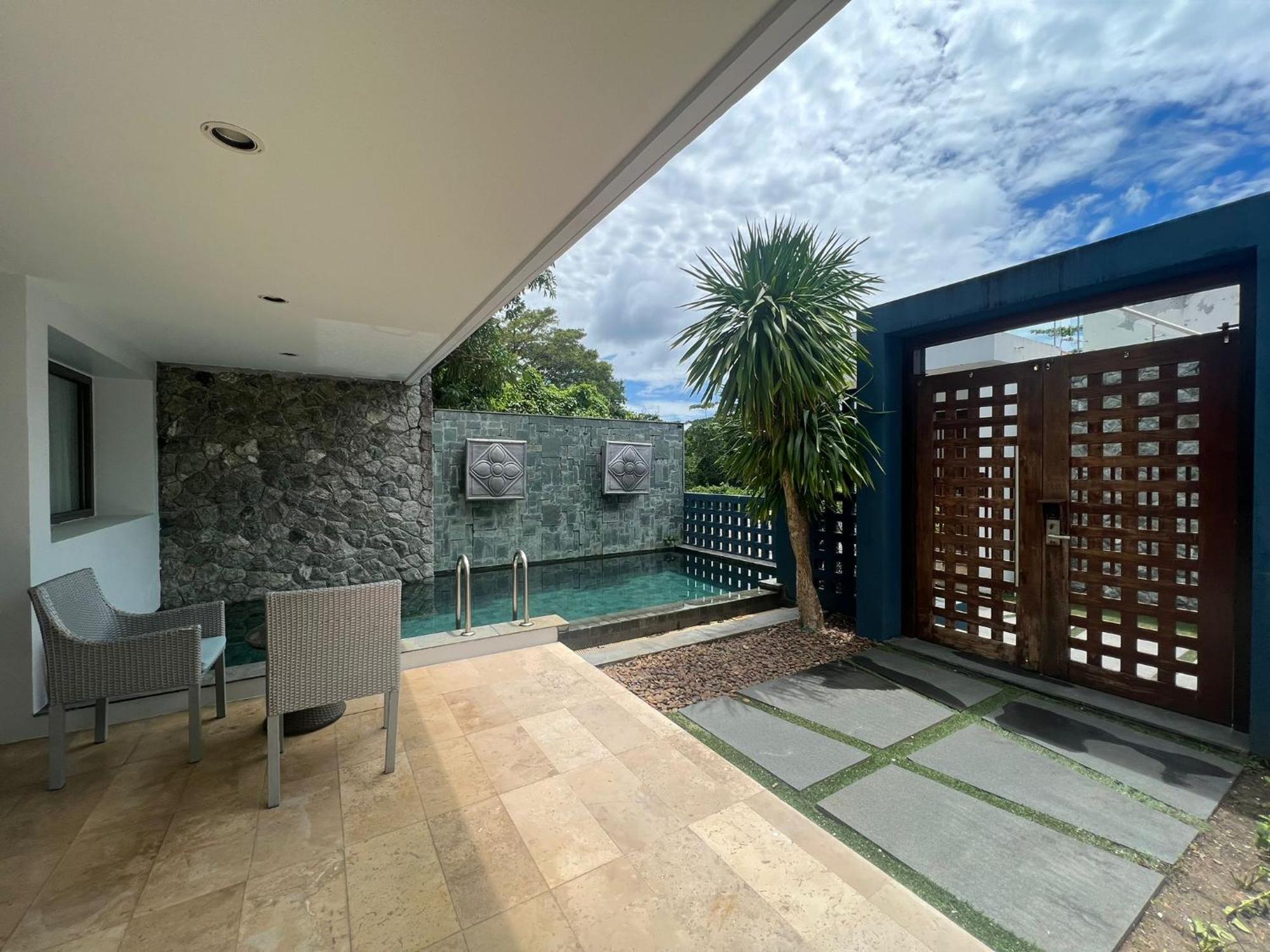 The Nchantra Beachfront Resort Phuket Exterior foto