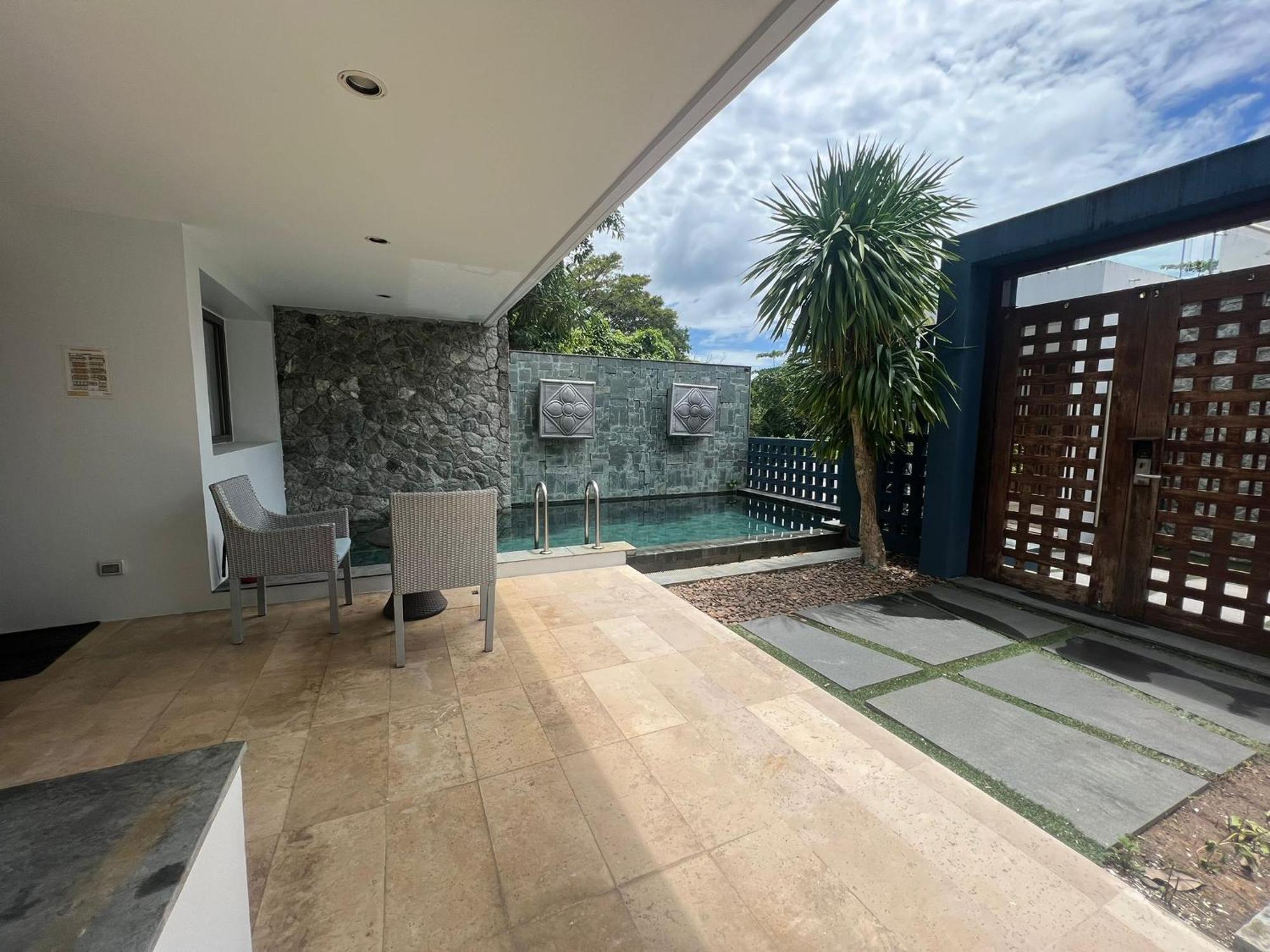 The Nchantra Beachfront Resort Phuket Exterior foto