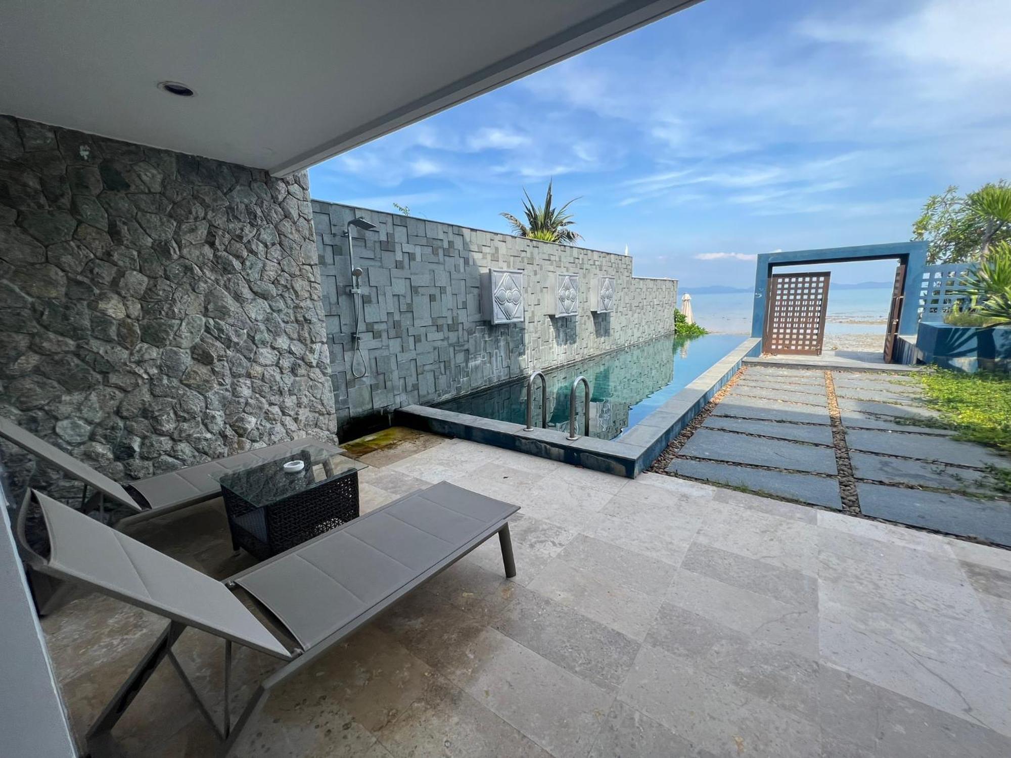The Nchantra Beachfront Resort Phuket Exterior foto