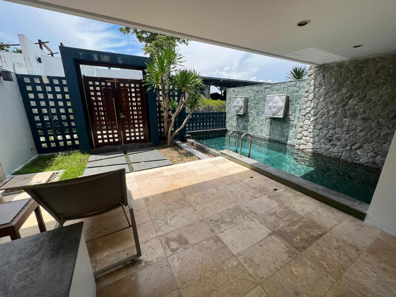 The Nchantra Beachfront Resort Phuket Exterior foto