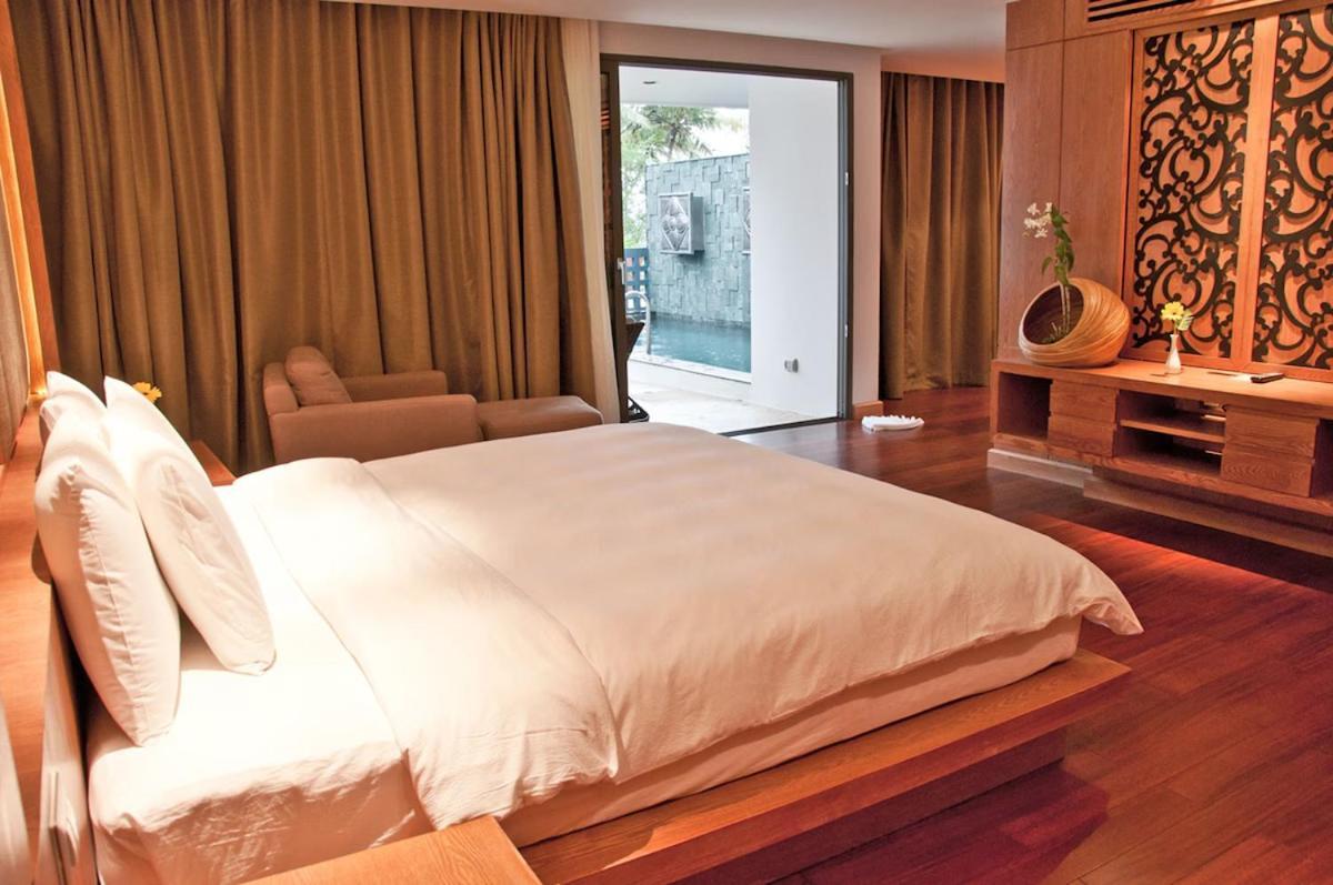 The Nchantra Beachfront Resort Phuket Exterior foto